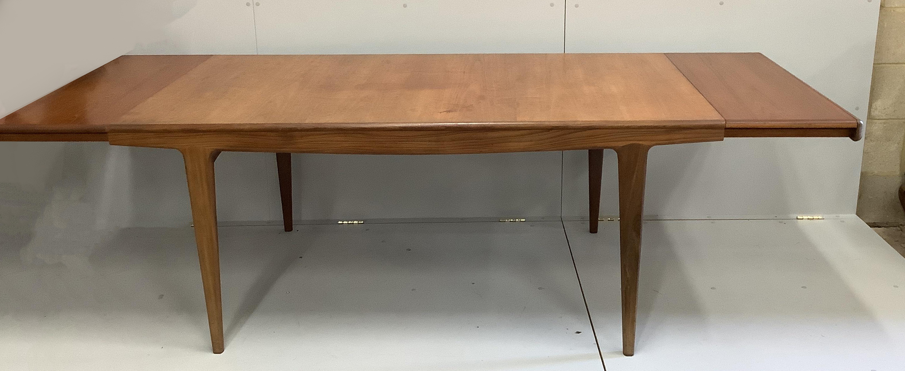 John Herbert for Younger Furniture - A rectangular teak extending dining table, 244cm extended, width 94cm, height 73cm